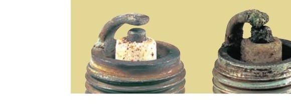 Overheated spark plug — white blistered insulator indicating lean condition